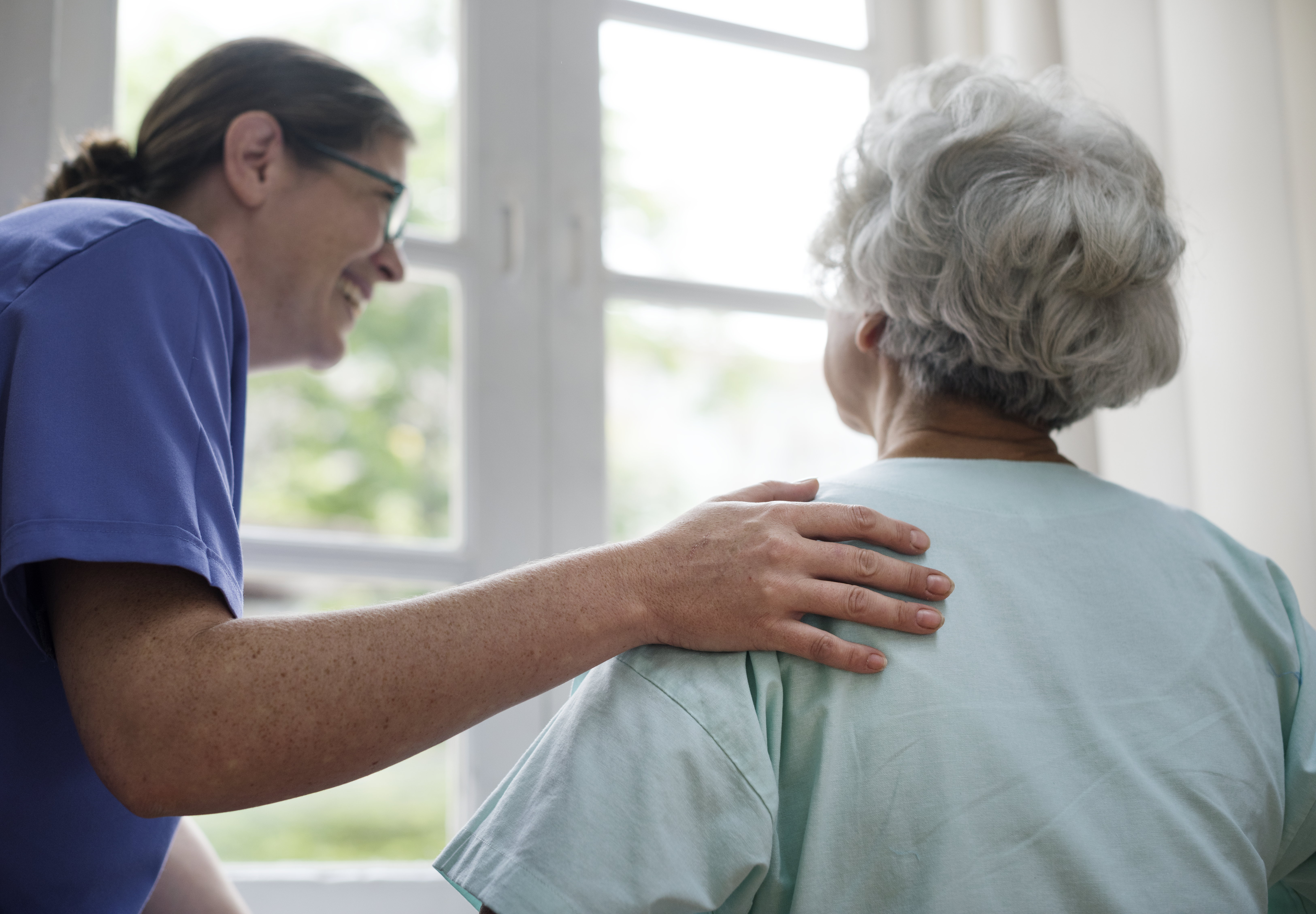 a carer hugging a patient